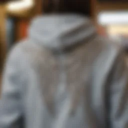 A close-up view of rhinestone-embellished angel wing hoodie