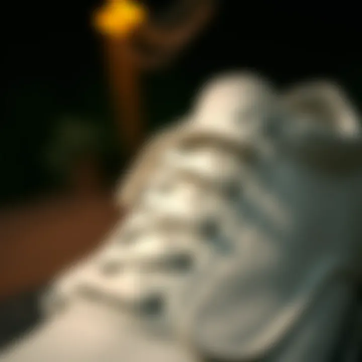 Close-up of white Vans showcasing perforated leather design