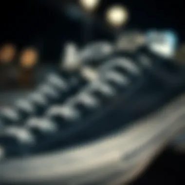 Close-up of size 4 black and white Converse detailing