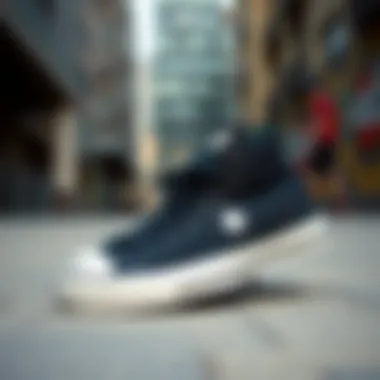 Stylish black and white Converse sneakers on urban background
