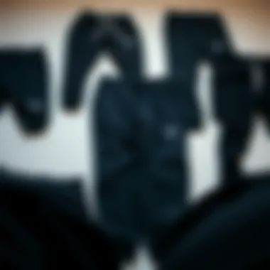 A collection of black sweatpants arranged artistically, showcasing different styles and fits.