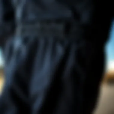 Close-up of the fabric texture and design details of black sweatpants, highlighting quality and comfort.