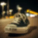 Close-up of Converse Chuck Taylor All Star black low top shoes showcasing the iconic star logo