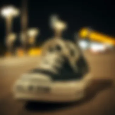 Iconic Design of Converse Chuck Taylor Close-up of Converse Chuck Taylor All Star black low top shoes showcasing the iconic star logo