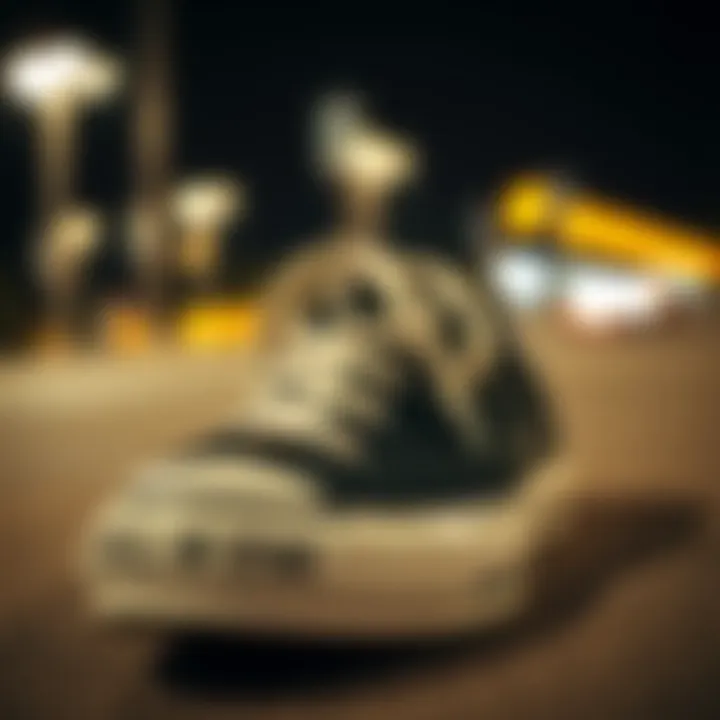 Iconic Design of Converse Chuck Taylor Close-up of Converse Chuck Taylor All Star black low top shoes showcasing the iconic star logo