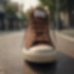 Dark brown Converse sneakers on a skateboard