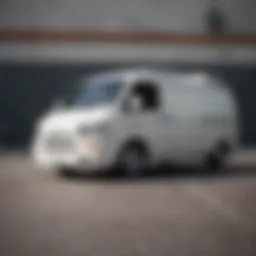 A close-up view of a flat white van showcasing its sleek design and texture.