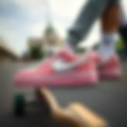Close-up of pink and white Nike shoes on a skateboard