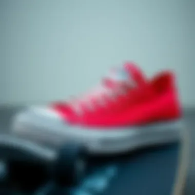 A close-up shot of red Converse shoes on a skateboard deck