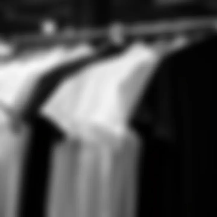 A collection of black and white t-shirts displayed together