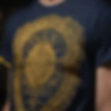 Close-up of intricate graphic designs on navy blue and yellow tees