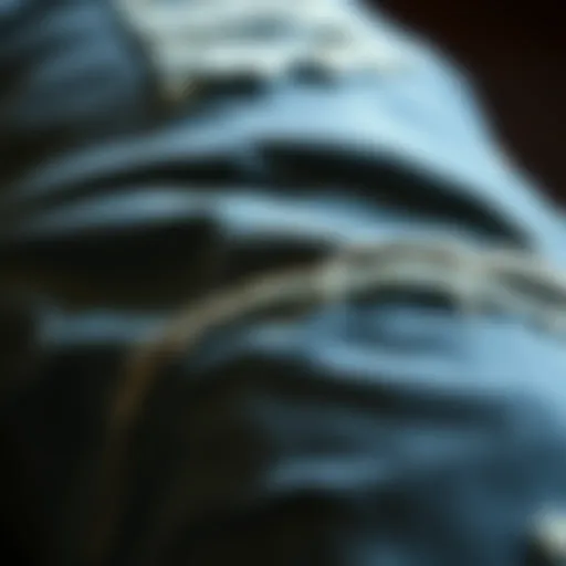 A close-up view of distressed denim showcasing unique wear patterns