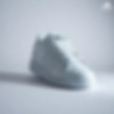 Sleek all-white Adidas Forum sneakers showcased on a minimalist background.