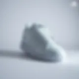 Sleek Design of Adidas Forum Sneakers Sleek all-white Adidas Forum sneakers showcased on a minimalist background.