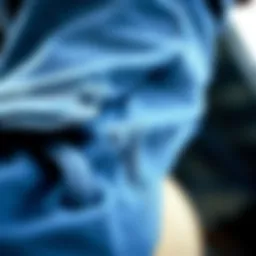 A close-up view of the fabric texture of blue denim cargo jeans