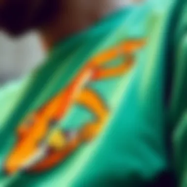 Close-up of a teal green top with skateboarding graphics
