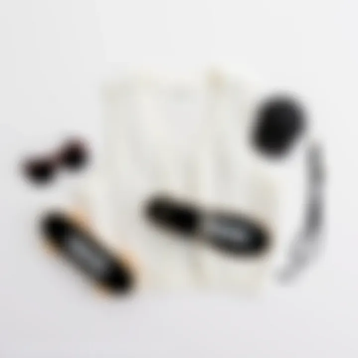 A minimalist flat lay of a white sweater vest with complementary accessories